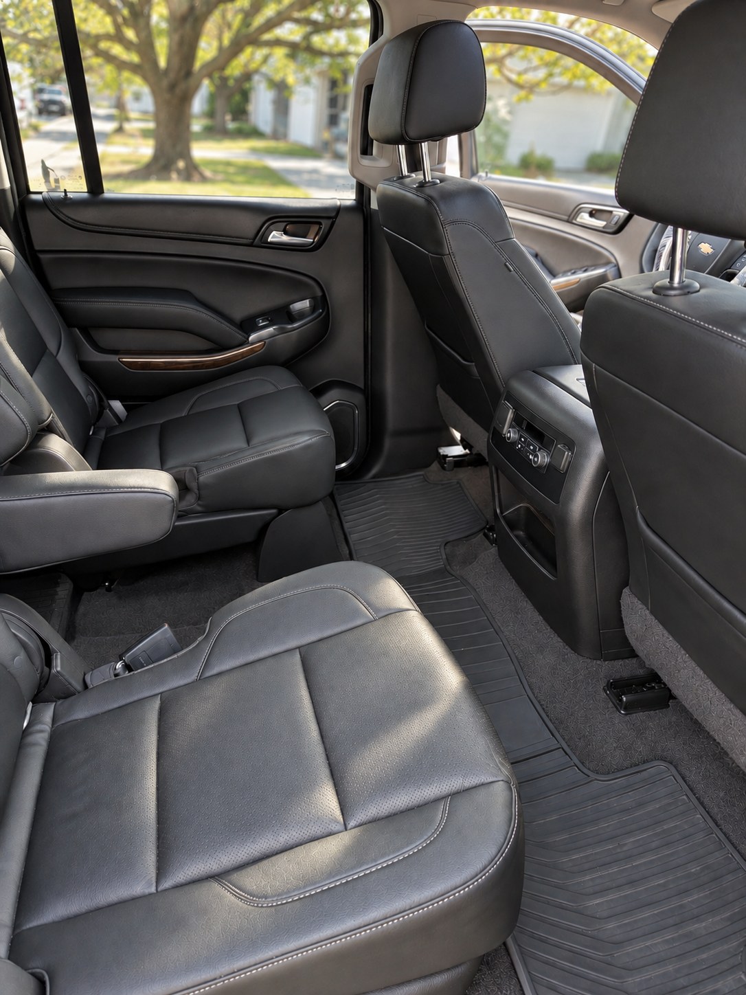 Finished black leather SUV rear cabin after an interior detail